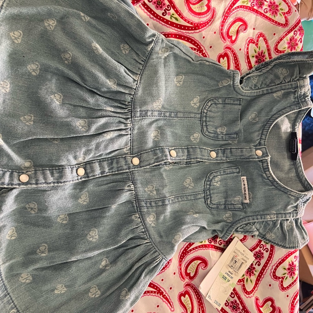 This is a Calvin Klein jeans 2 piece 18M set, with colors blue and grey hearts